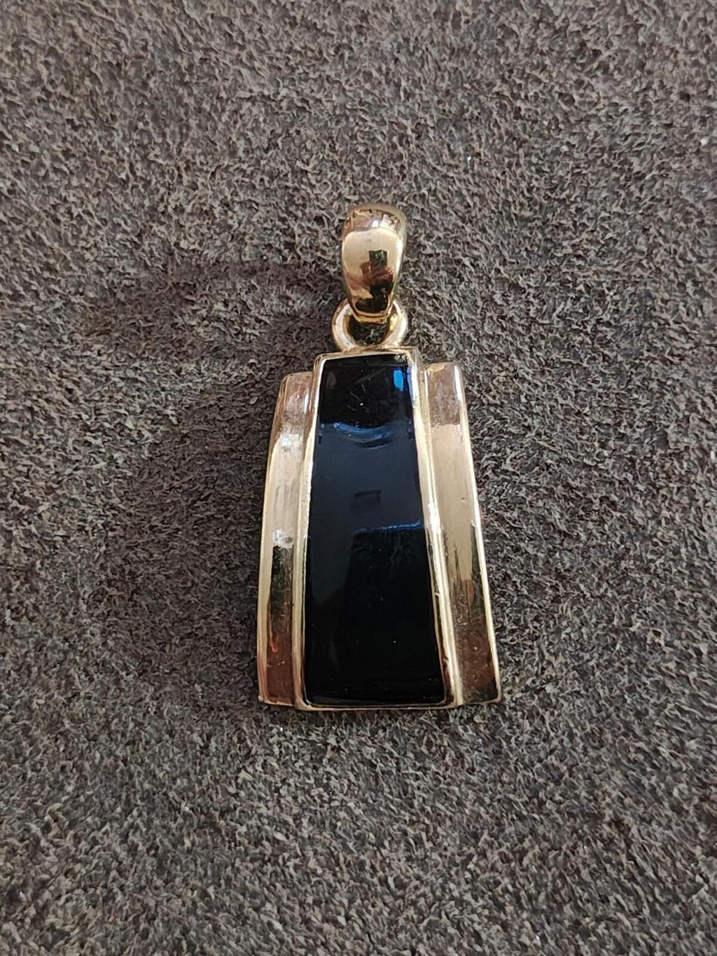 Black enamel gold-tone slide pendant charm with rectangular enamel center and top bail