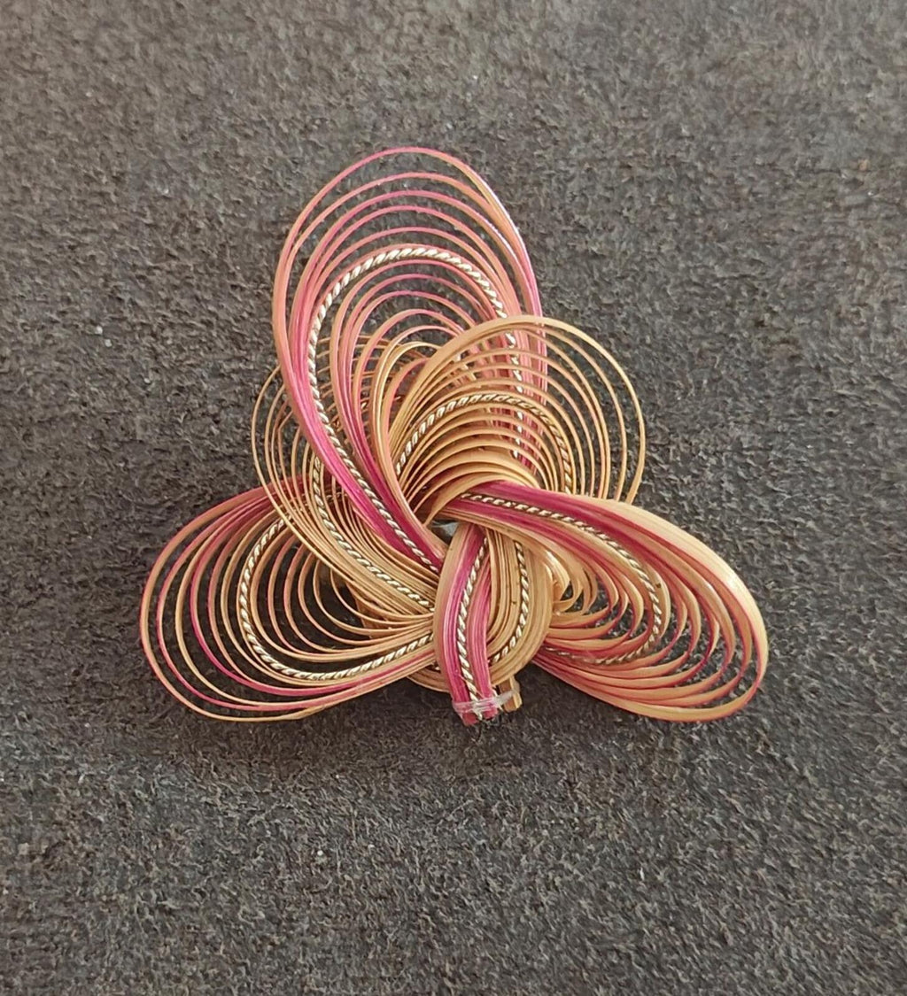 Quilled bamboo/rattan folk art brooch, spiral flower with pink and tan coil layers