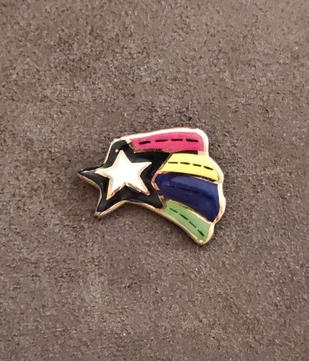 Glazed ceramic shooting star pin brooch with rainbow top and blue body, white star