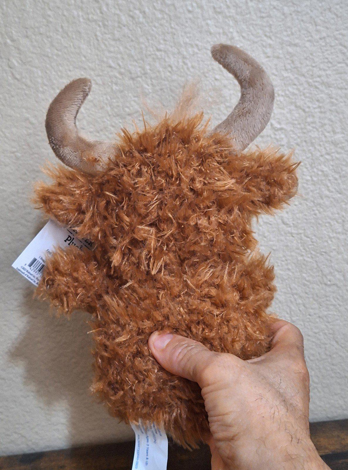 Brown Easter shaggy bull plush with blue eyes, green gingham bow, hand holding