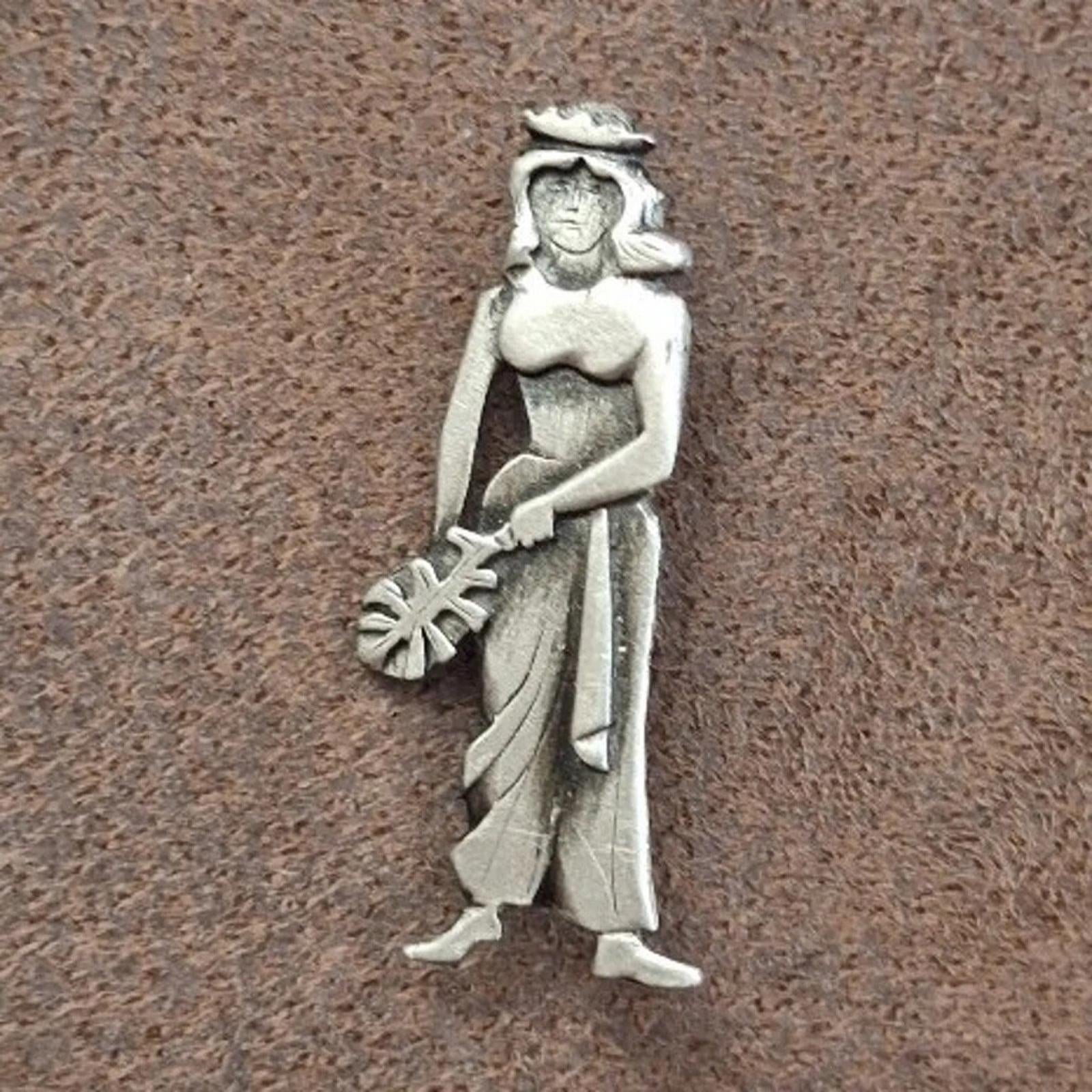 Metzke pewter girl brooch pin, centered front view with draped dress, silver-tone