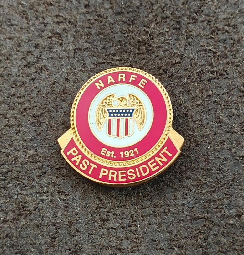 Red and gold enamel commemorative pin with “NARFE” ring and “PAST PRESIDENT”