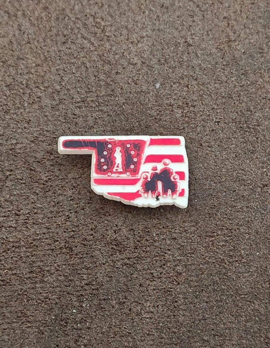 Red and white Oklahoma map plastic lapel pin, centered front design