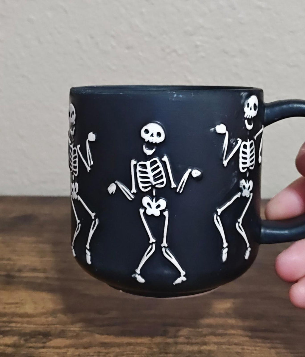 Dancing Skeletons Black Earthenware 13 oz 3D Embossed Black Mug.