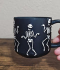 Dancing Skeletons Black Earthenware 13 oz 3D Embossed Black Mug.