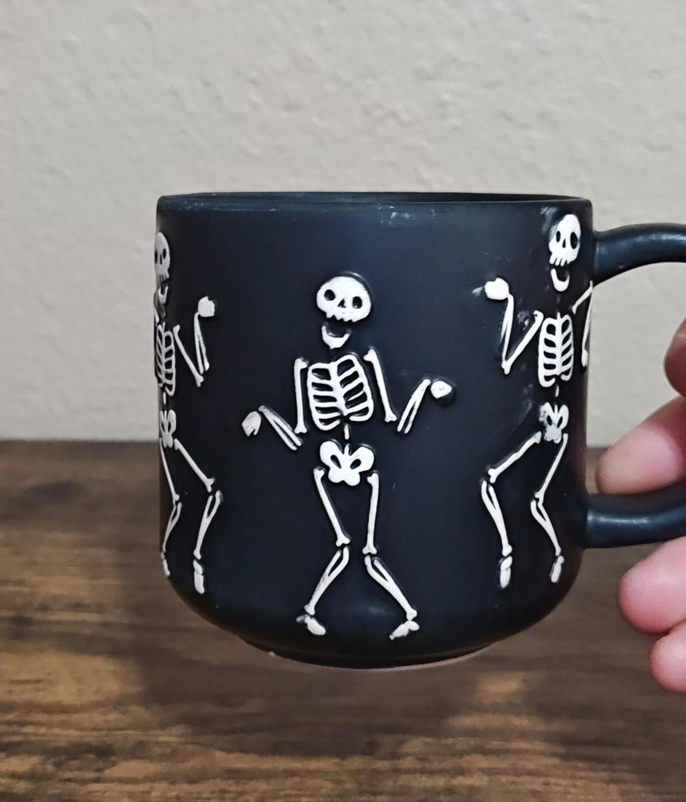 Dancing Skeletons Black Earthenware 13 oz 3D Embossed Black Mug.
