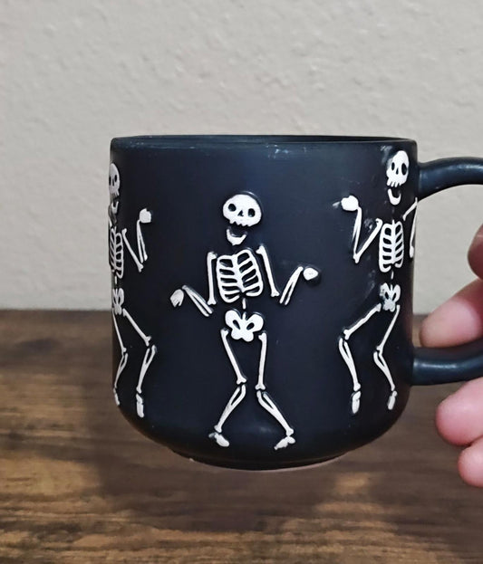 Dancing Skeletons Black Earthenware 13 oz 3D Embossed Black Mug.