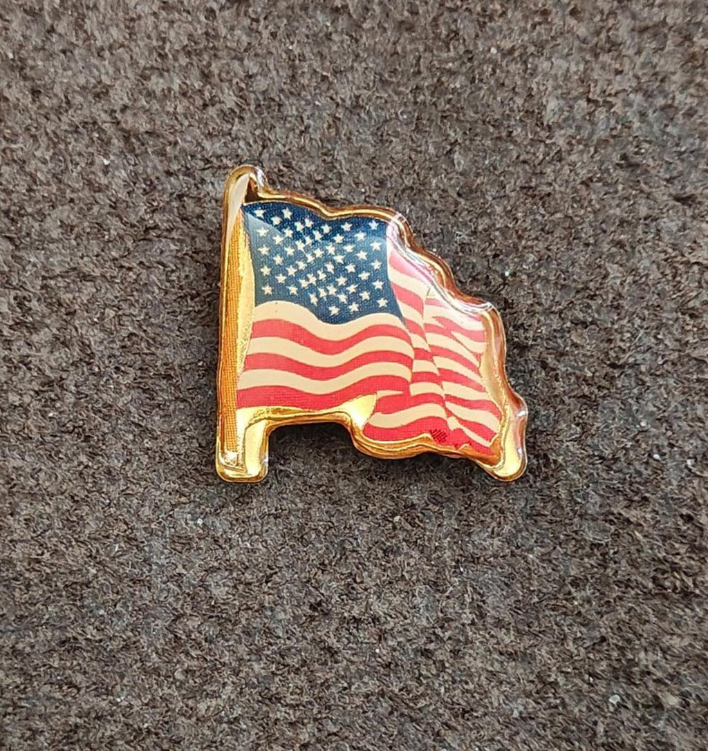Gold-tone United States flag pin, enamel stars and stripes on wavy silhouette