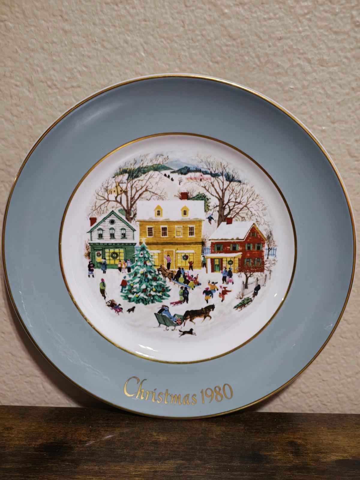 Light blue Avon Country Christmas porcelain plate with 1980 winter village scene and gold rim