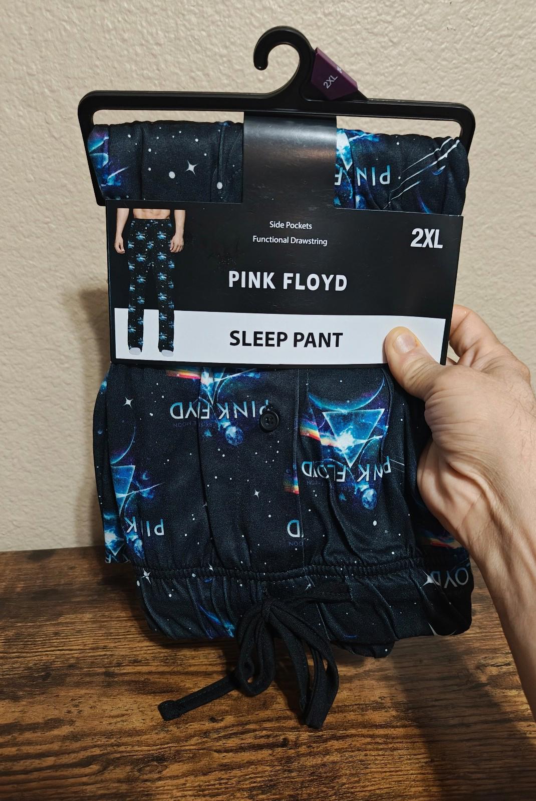 Black graphic sleep pants on hanger, 2XL size, with drawstring waist and starry print