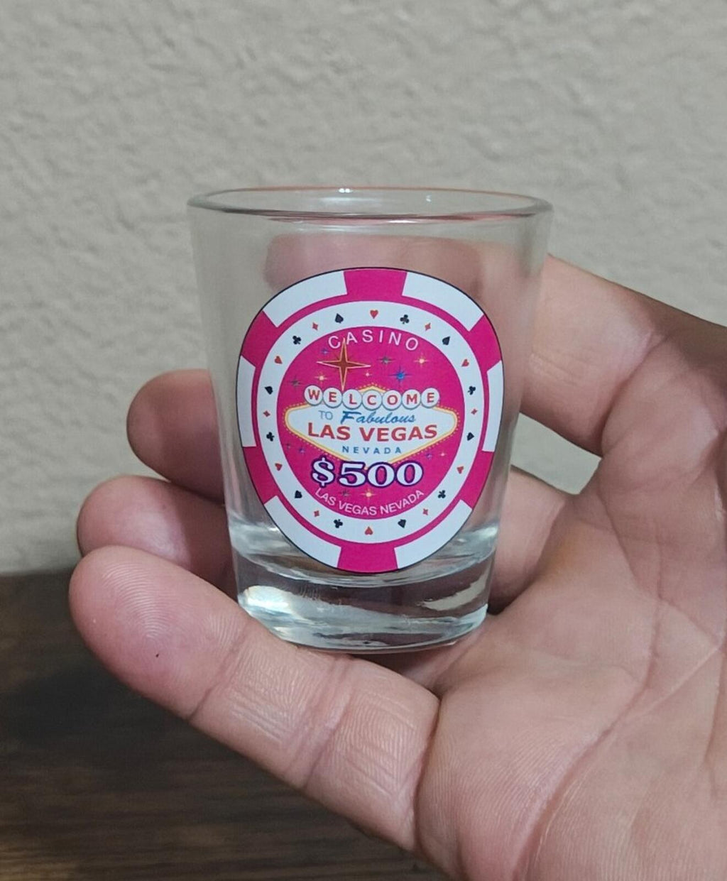 Pink casino chip style shot glass with “Welcome Las Vegas Nevada $500” label