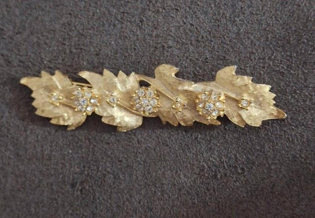 Gold tone leaf and flower rhinestone brooch pin, crystal centers with teardrop details