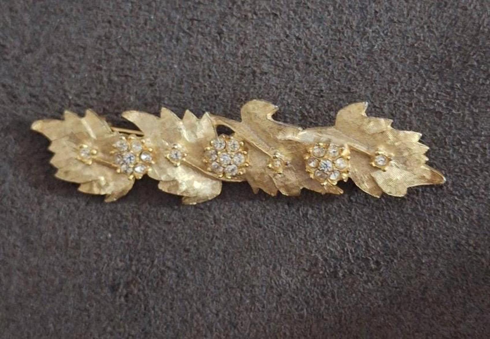 Gold tone leaf and flower rhinestone brooch pin, crystal centers with teardrop details