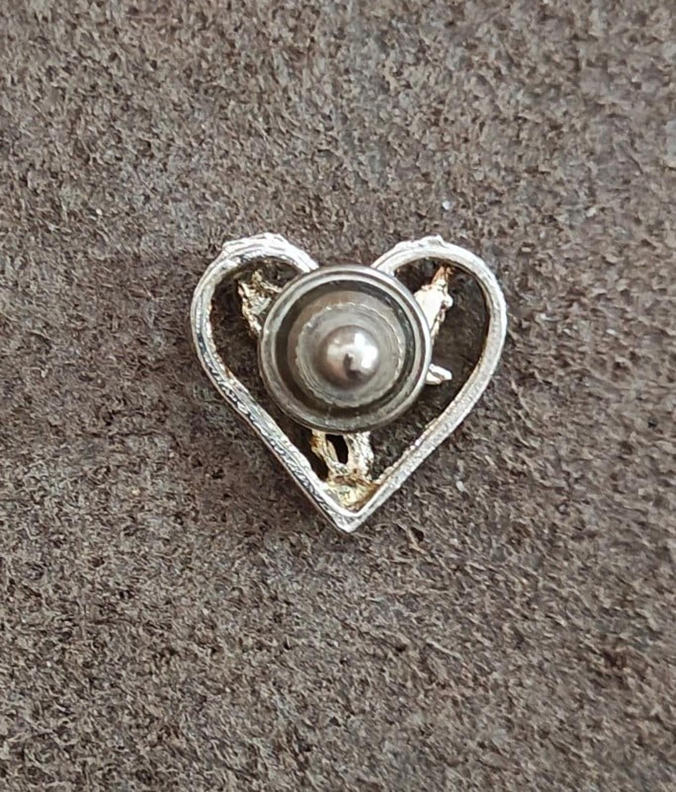 1980's Silver Tone Angel Inside A Heart Pin