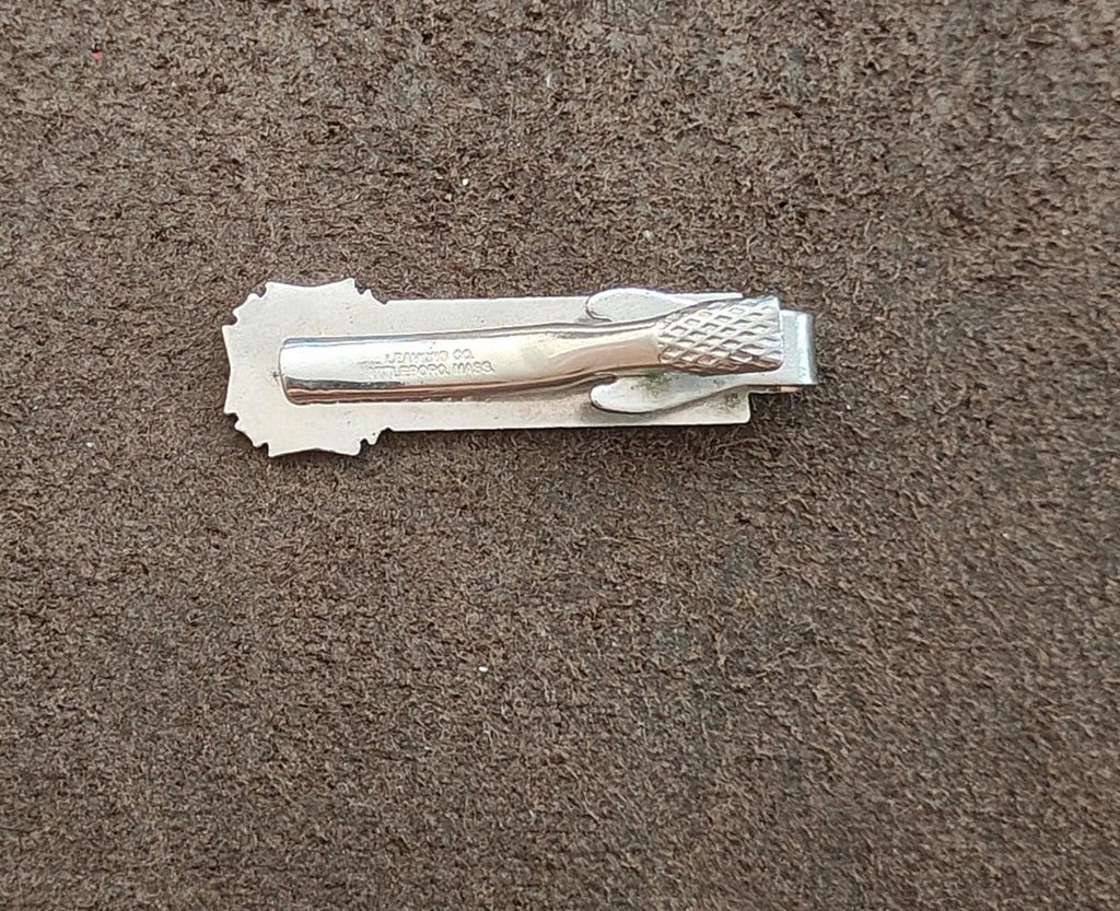 Silver-tone tie clip back view with clasp and stamped details