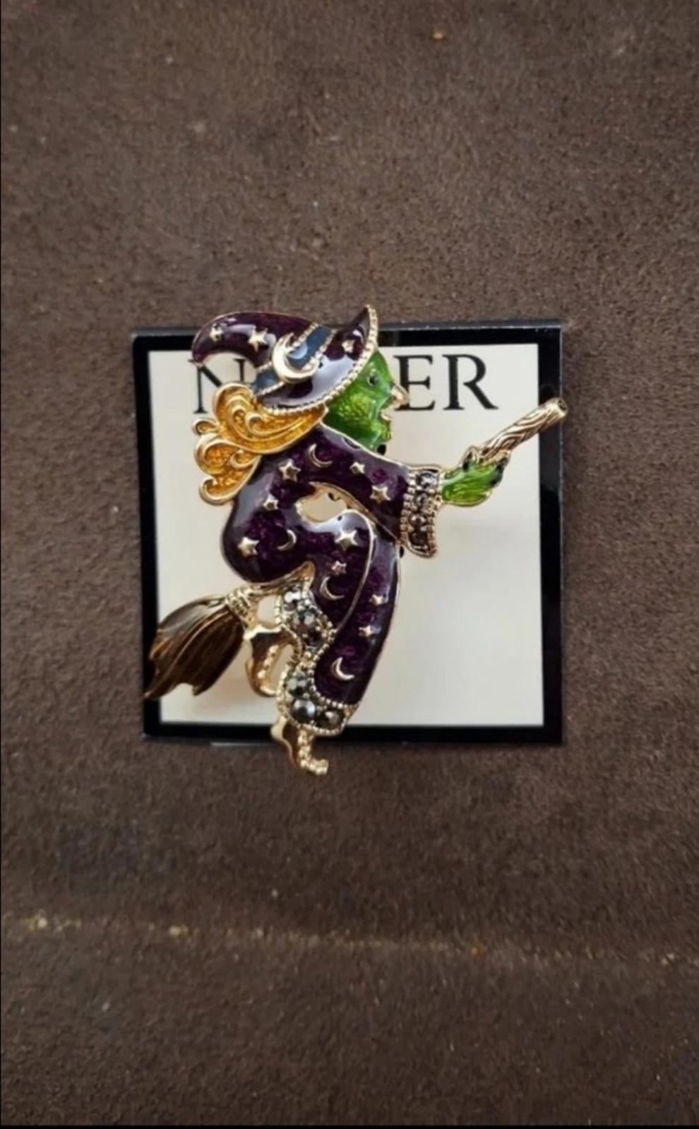 Gold-tone witch enamel pin brooch on card, dark purple cloak with green accents