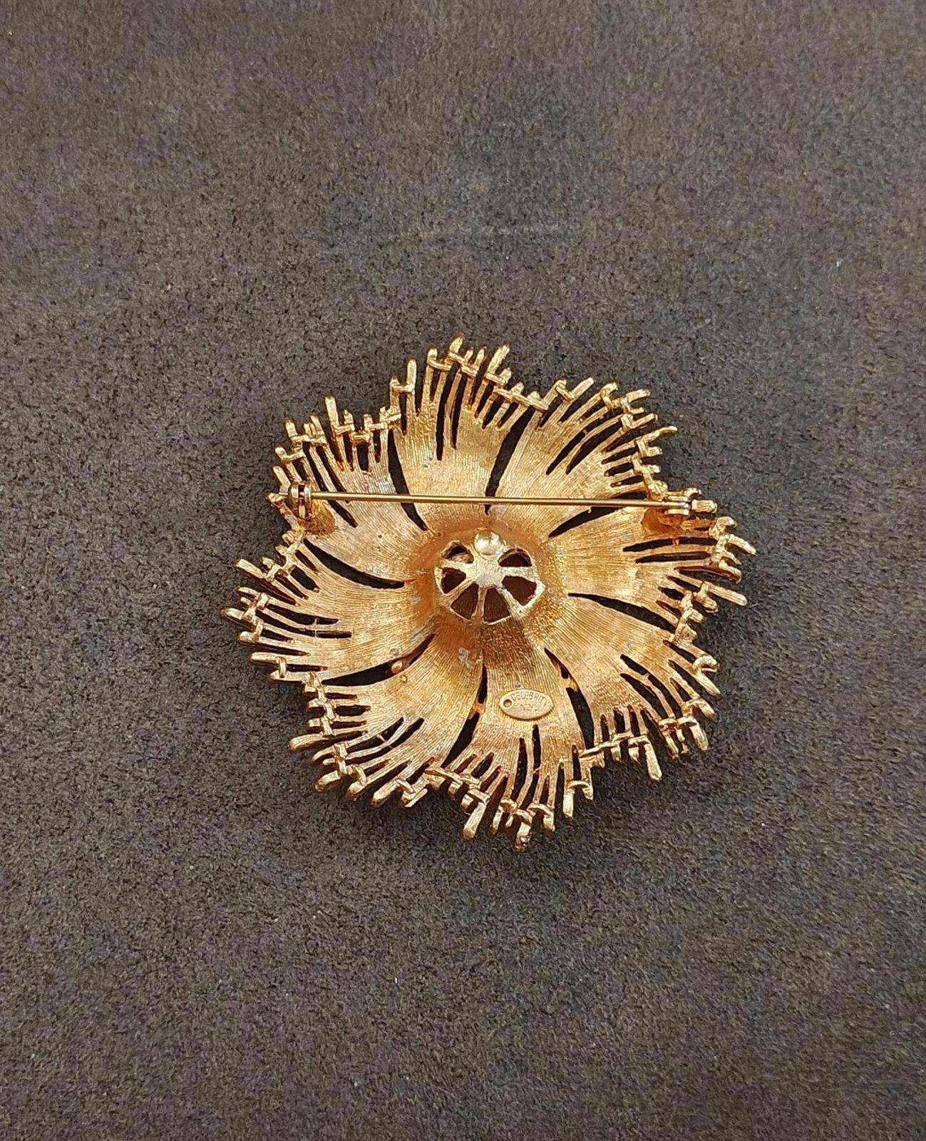 Gold-tone starburst brooch back with pin and round openwork plate design