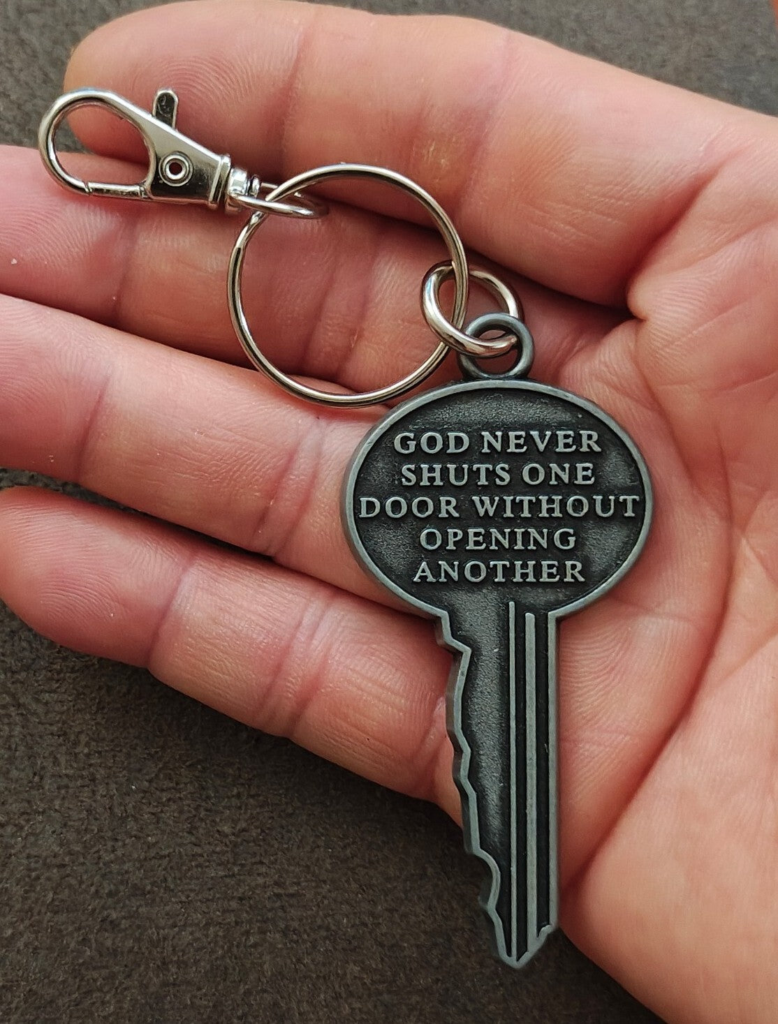 "God never shuts one door without opening another." Cast Metal Keychain
