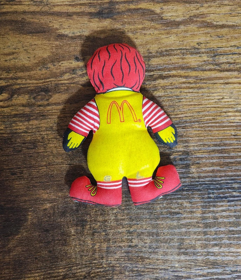 Ronald McDonald plush doll, rear view, red hair, yellow apron and red shoes