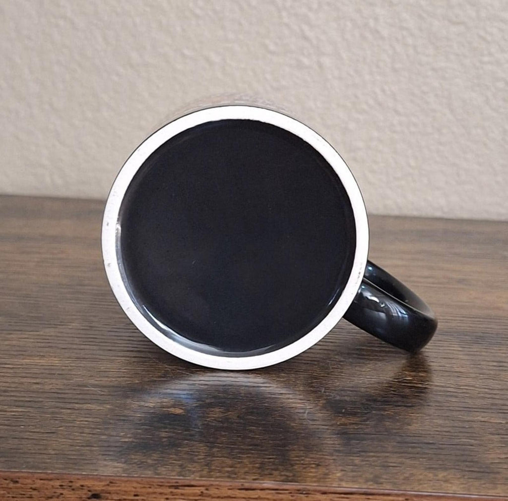 Black ceramic 11 oz mug underside view with silver rim and curved handle