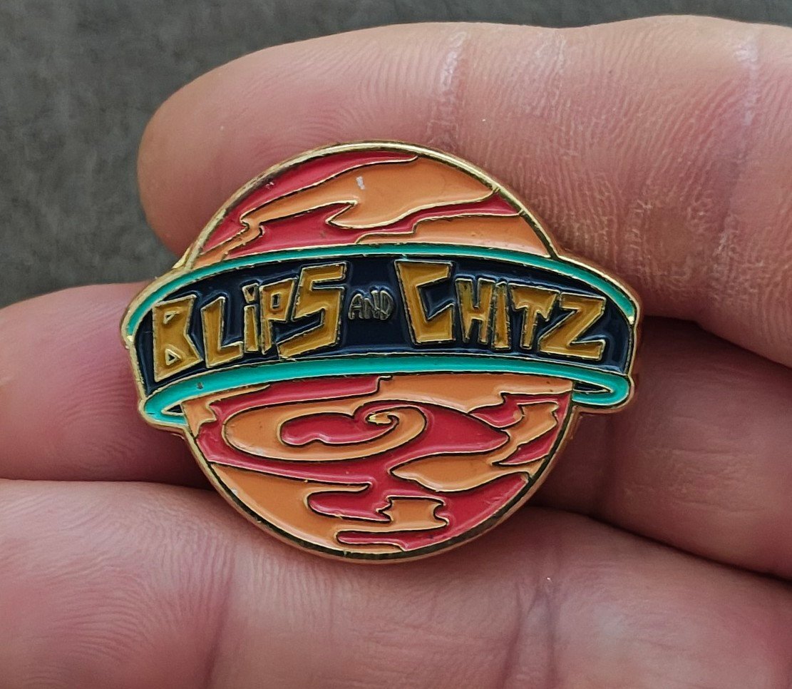Funko Rick & Morty Blips & Chitz Exclusive Gold Tone Orange Enamel Pin.