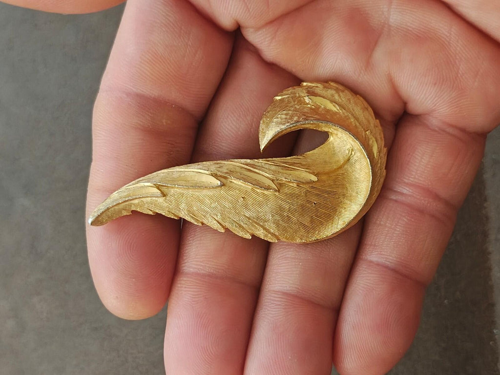 1960s Gold Tone Textured Feather Swirl Brooch