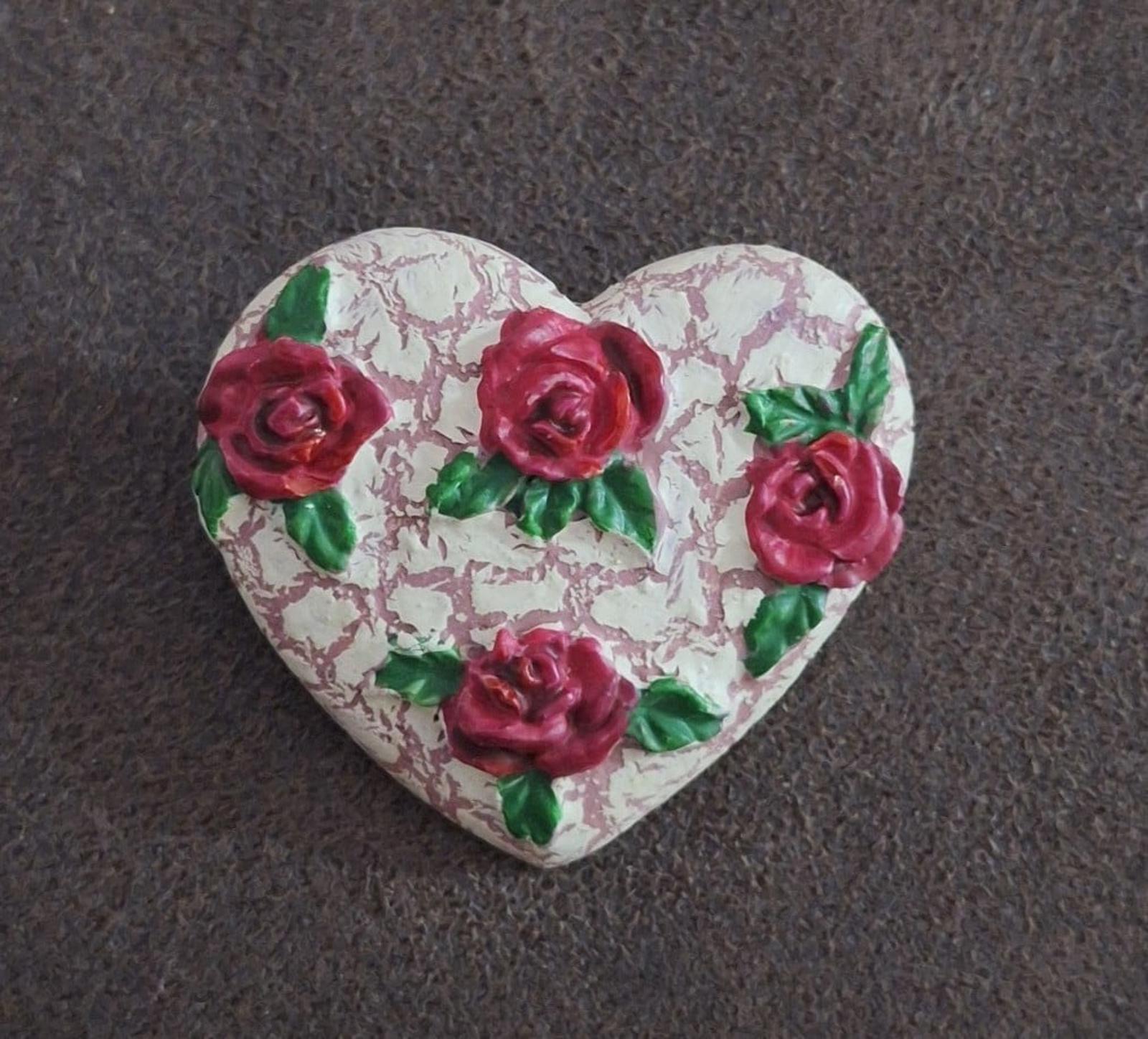 Heart-shaped resin pin, crackled white heart with red roses and green leaf accents