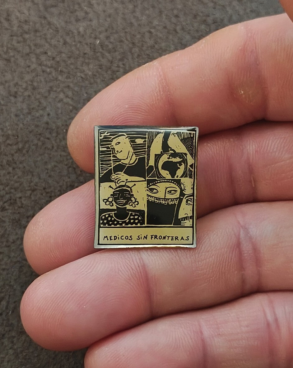 1990s Médicos Sin Fronteras (Doctors Without Borders) Silver Tone Enamel Pin