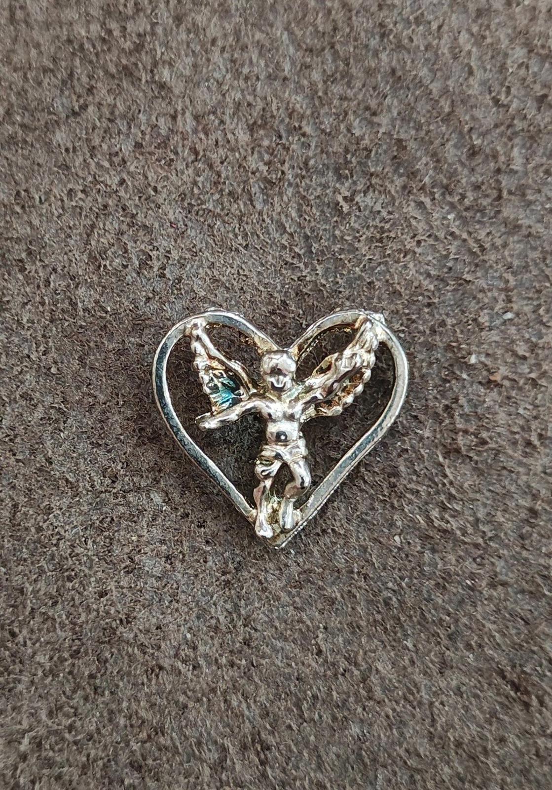 1980's Silver Tone Angel Inside A Heart Pin