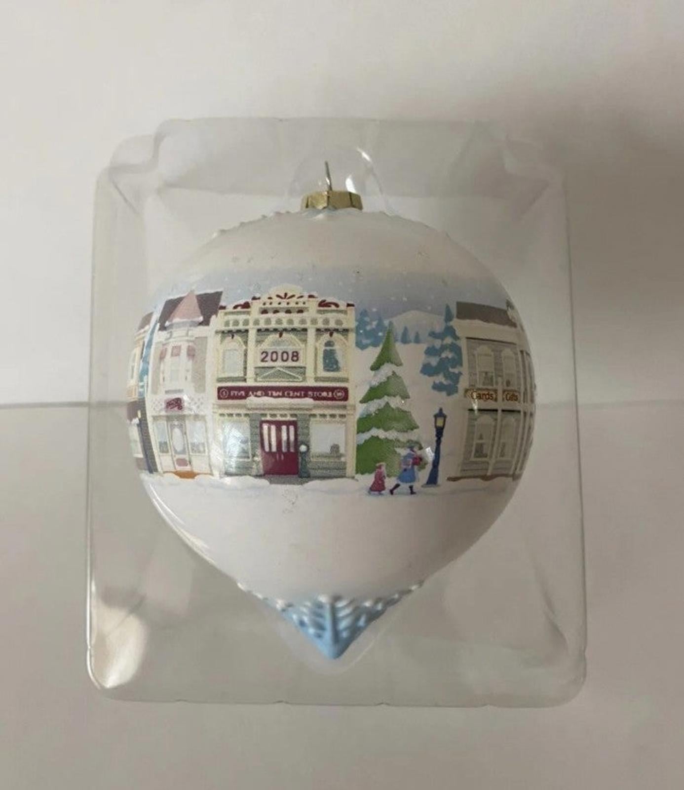 Hallmark Keepsake teardrop ornament with Main Street building scene, clear bauble