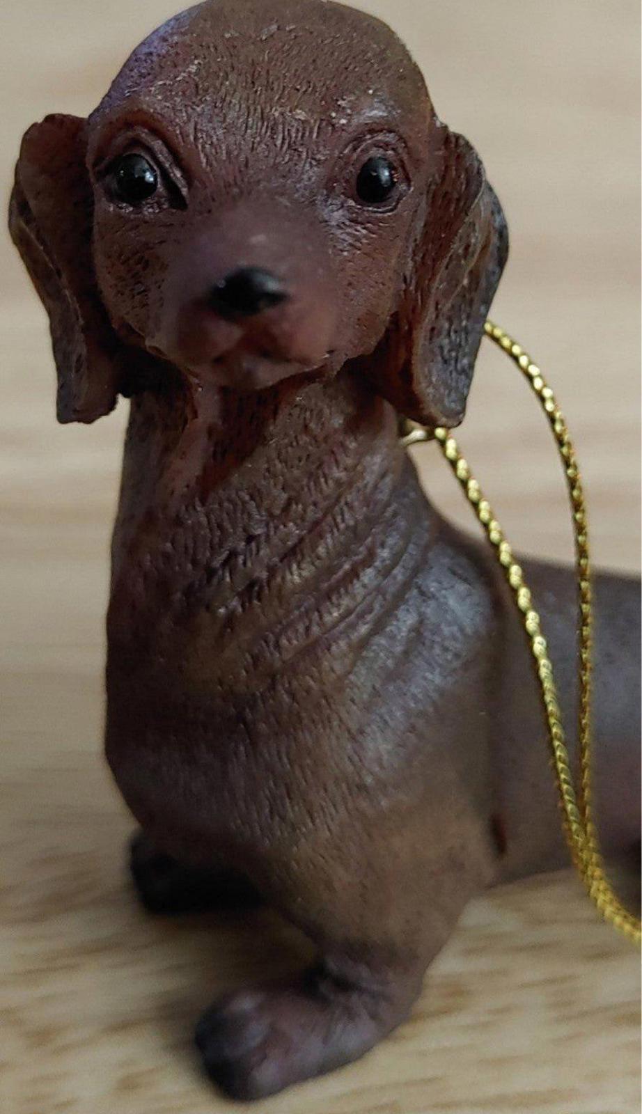Chocolate brown dachshund ornament figurine with gold cord and hanging hook