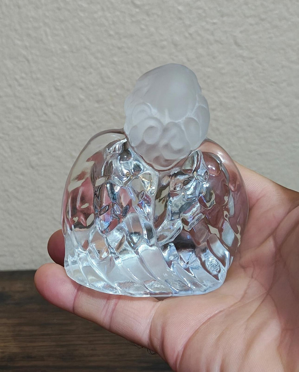 Clear glass guardian angel figurine, back view with pink gemstone accent at chest