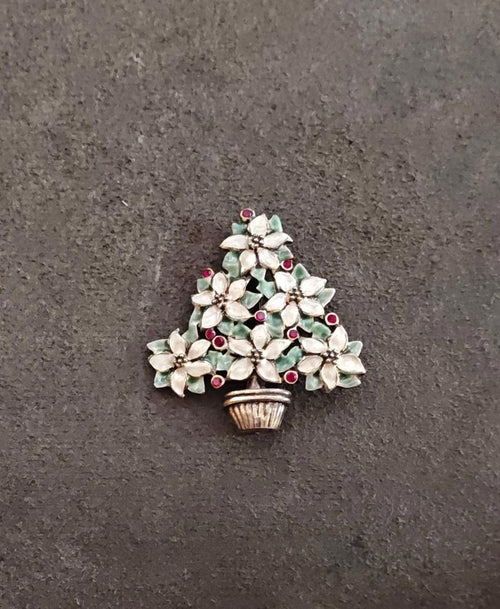 Christmas tree brooch with gold basket, white flower clusters, green leaves, red berries