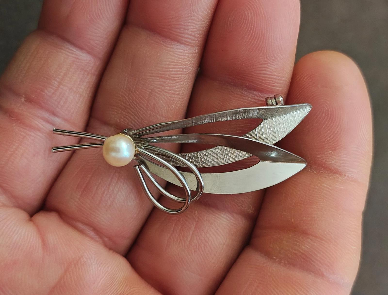 Sterling silver modernist brooch with cultured pearl and leaf-like metal cutouts
