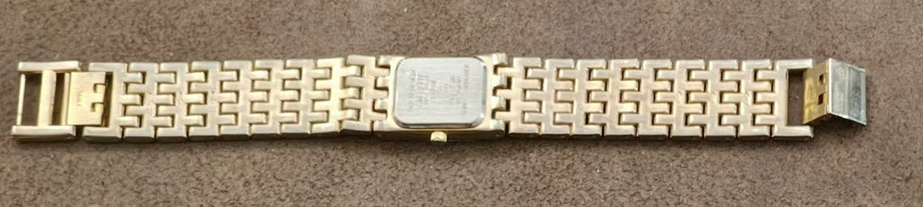 Gold-tone watch bracelet band with geometric links and rectangular clasp