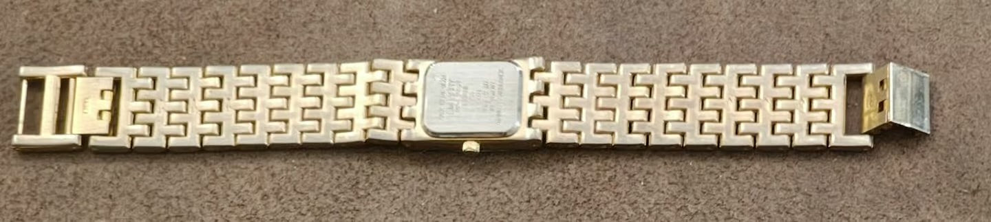 1990s Embassy by Gruen Gold Tone With Black Dial Ladies Diamond Accent Watch