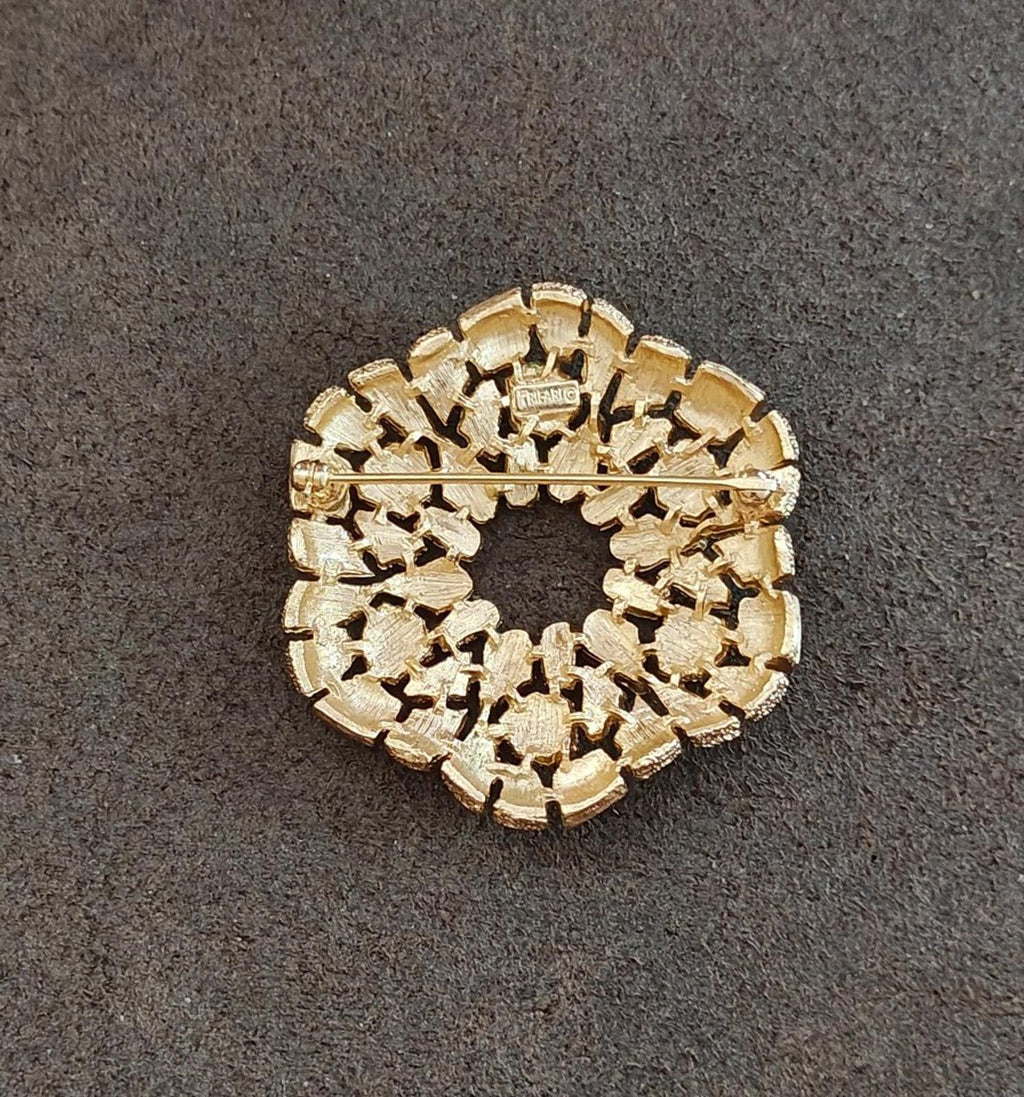 Gold-tone textured back of wreath brooch with hinge and clasp hardware
