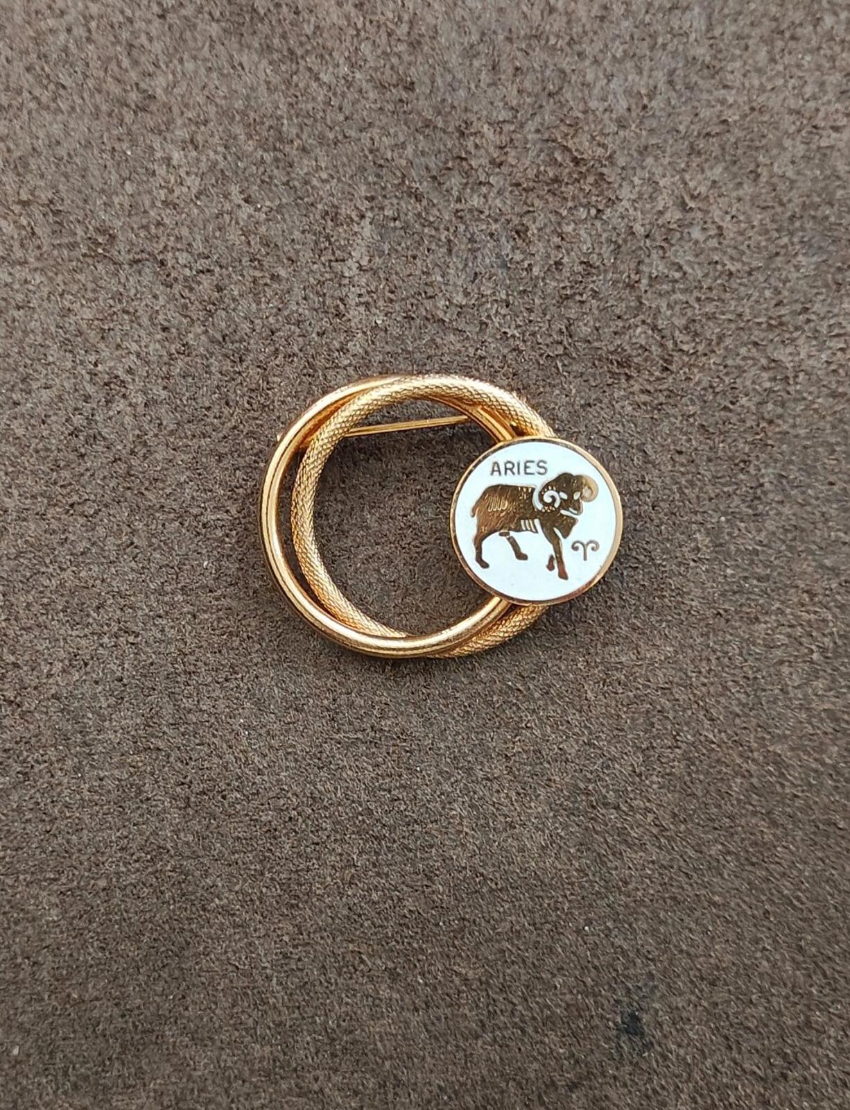 1970s Gold Tone Aries Zodiac Sign Double Circle White Enamel Brooch Pin