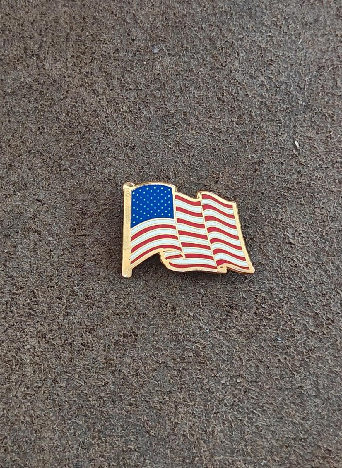 1980s Patriotic Gold Tone Enameled American Wavy Flag Pin.