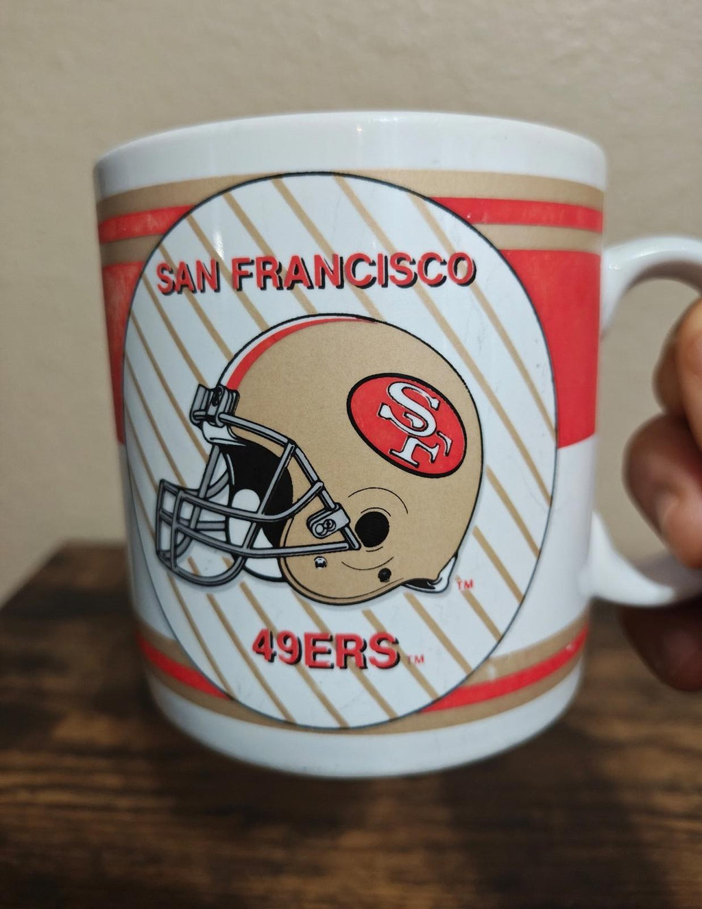 San Francisco 49ers football helmet graphic mug, red stripes around the cup.