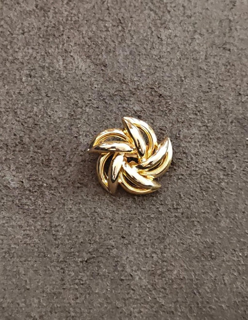 Gold-tone flower brooch, small twisted-petal center detail