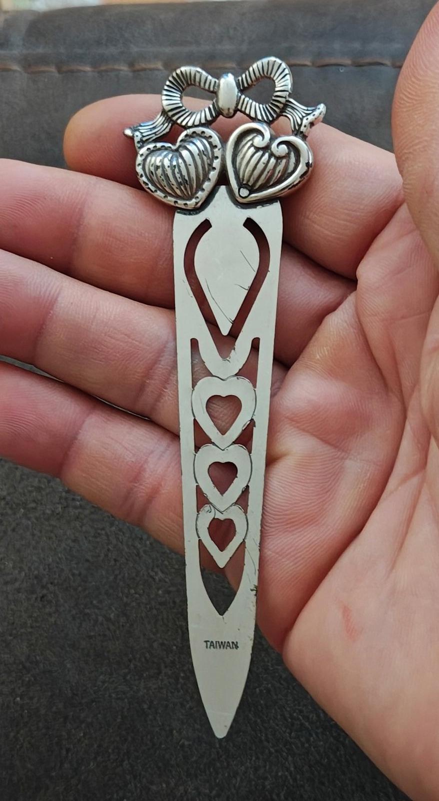 Silver plated letter opener bookmark with multiple hearts and bow-like top detail