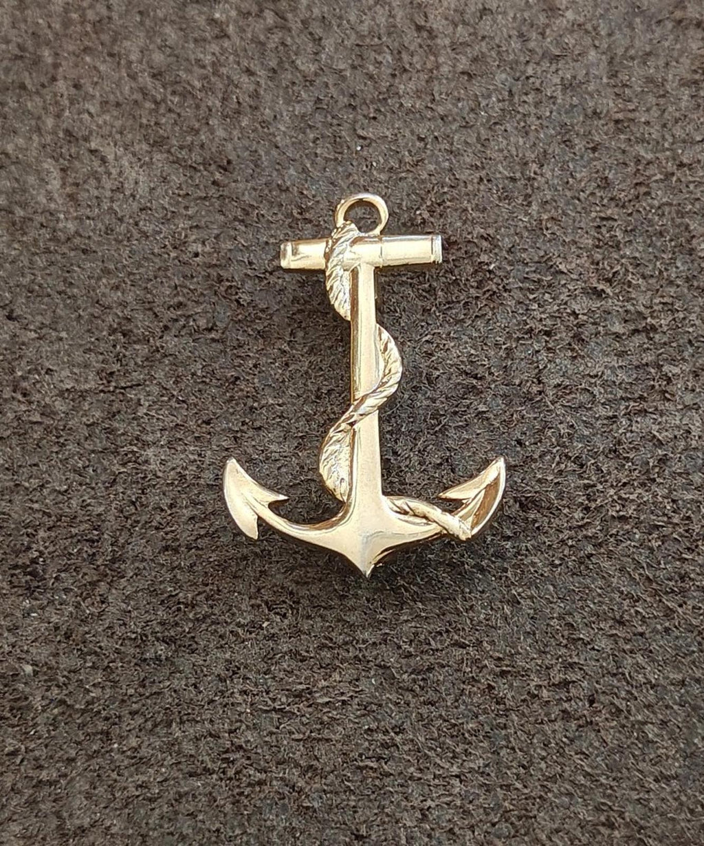 Gold-tone anchor pendant, front-facing nautical charm with top loop