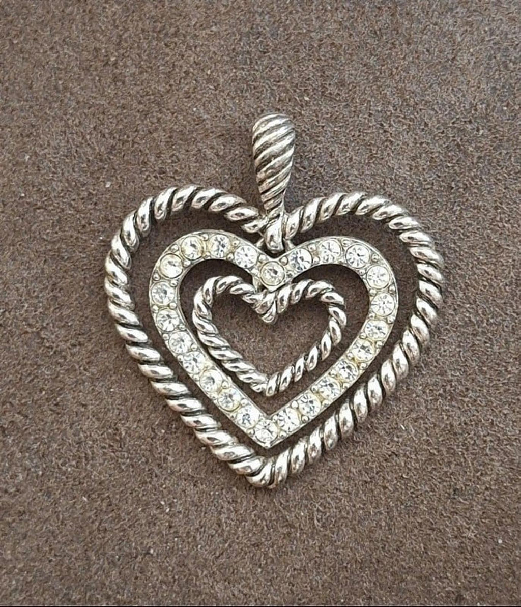 Silver heart pendant with rope trim and rhinestone accents, front view