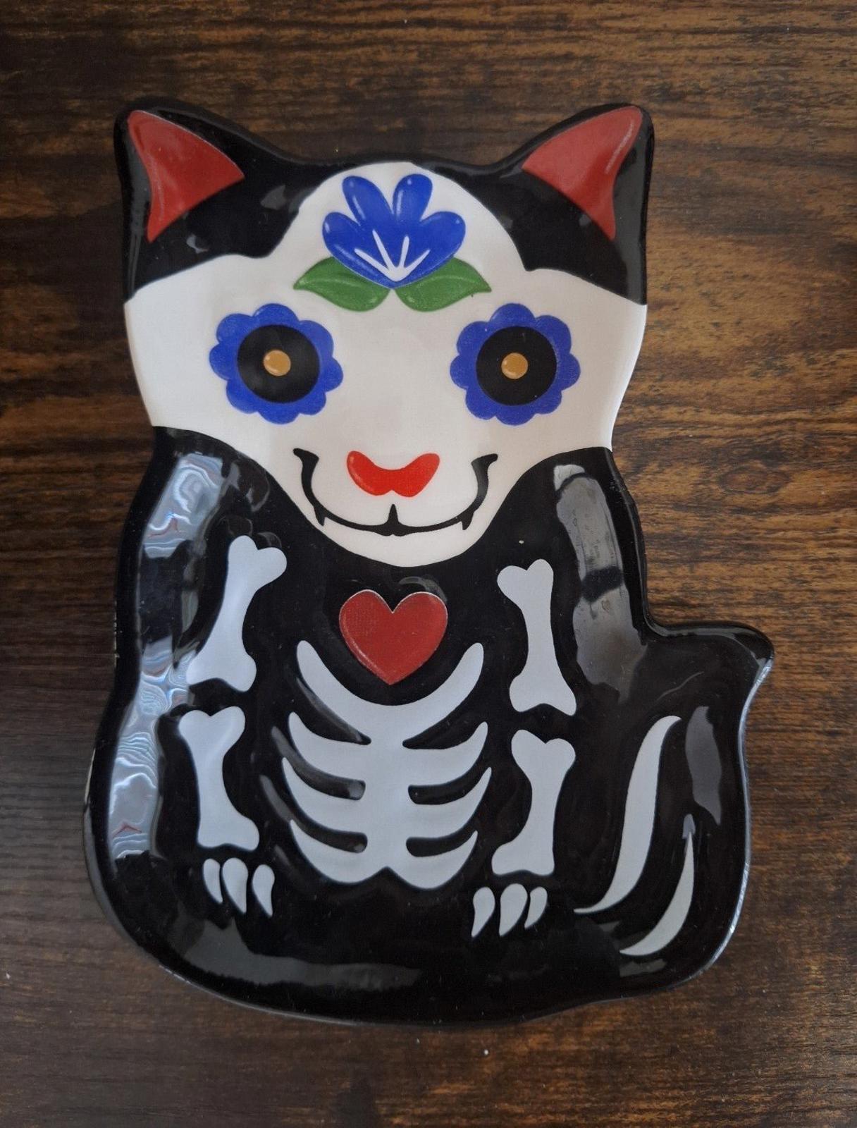 Black 3D cat sugar skull trinket plate with blue flowers, red heart, and skeleton design