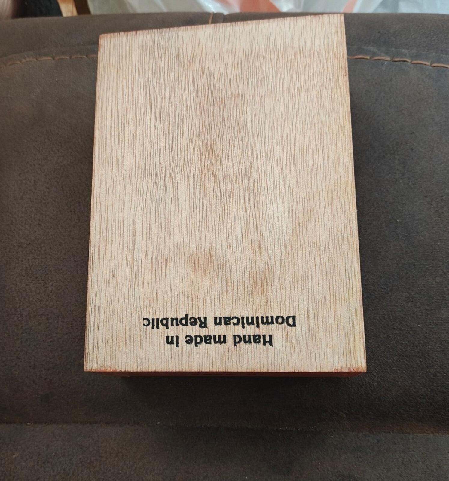 Wooden cigar box panel with reversed text reading "Dominican Republic"