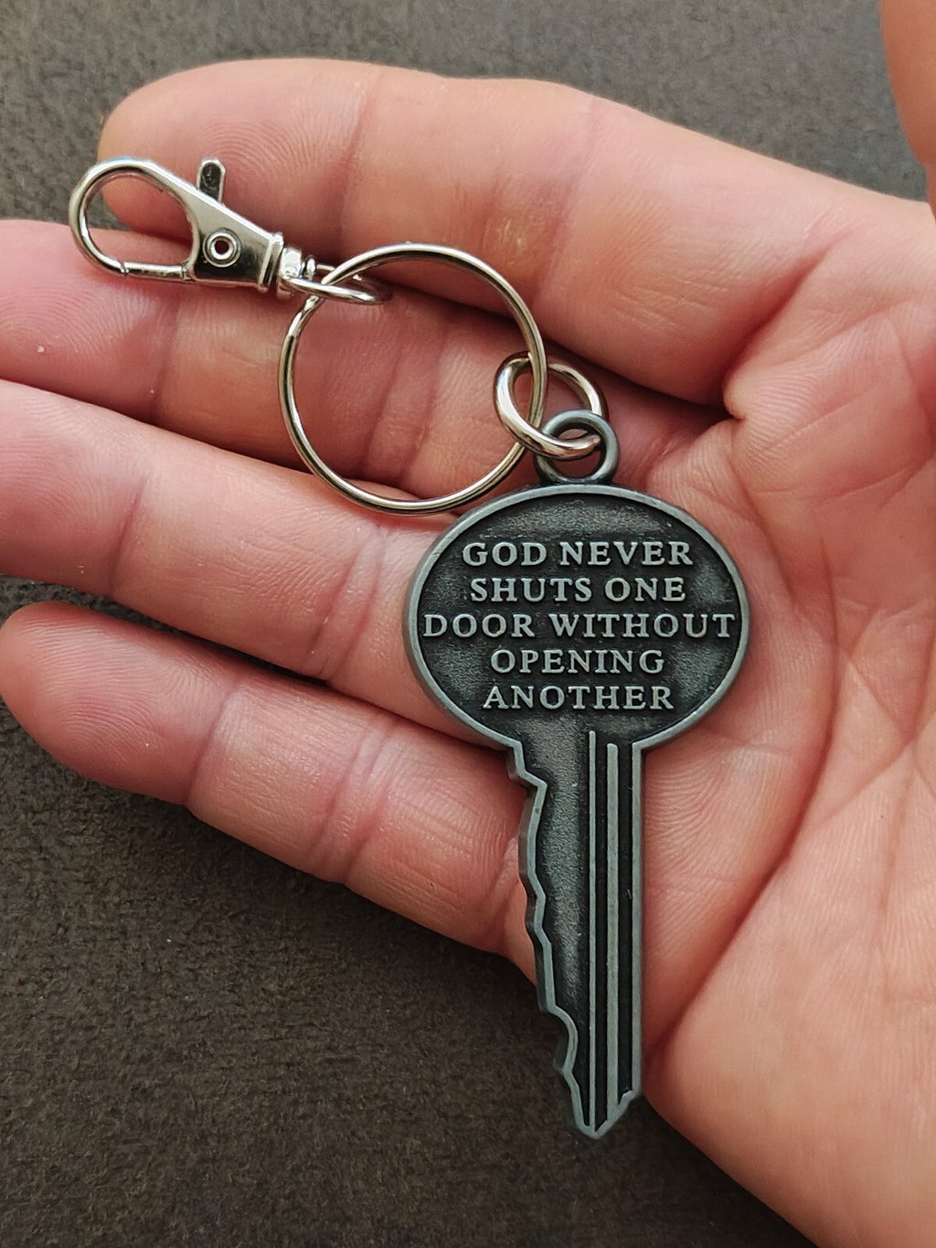 "God never shuts one door without opening another." Cast Metal Keychain