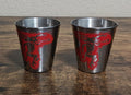 Stainless steel shot glasses set of 2 with red dragon graphic on dark exterior