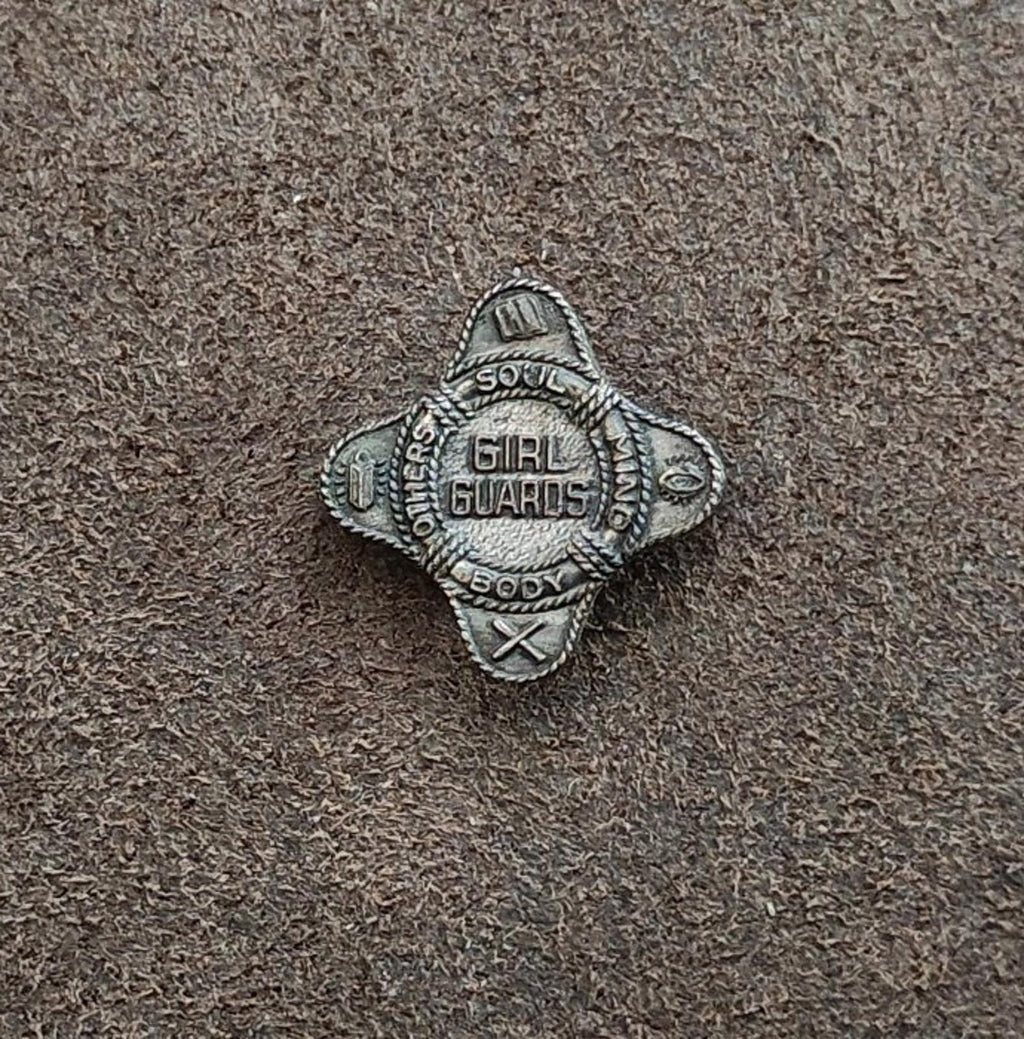 Vintage Girl Guards membership badge pin, dark silver-tone front with Girl Guards lettering