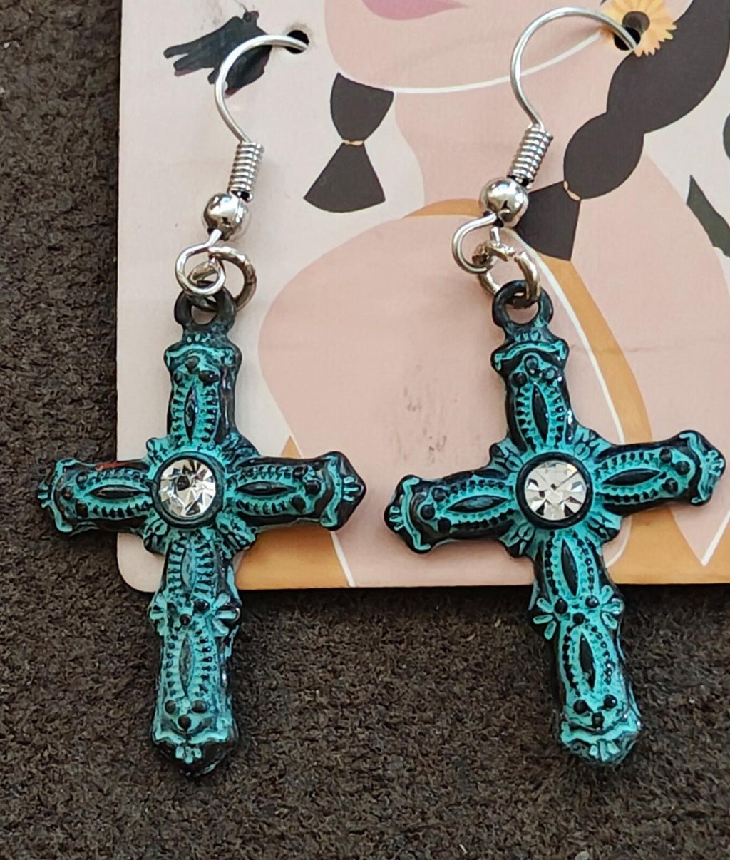 Turquoise cross drop earrings with rhinestone centers on silver-tone hooks, spring rings